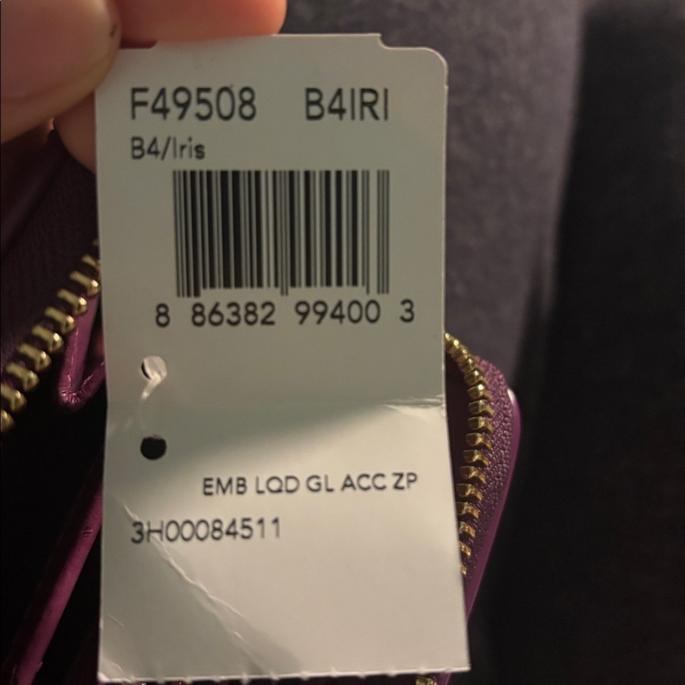 Coach F49508 Patent Signature Iris Purple Long
Bow Heart Zip Wallet (2012-2013) - Picture 12 of 12